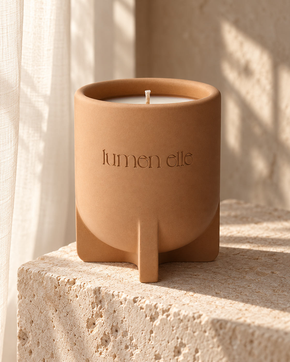 Lumenelle Mediterranean Fig stoneware candle beside a softly lit window